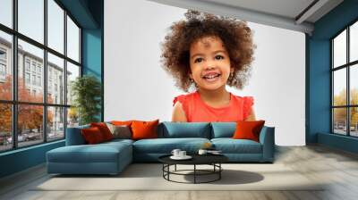 childhood and people concept - happy little african american girl over grey background Wall mural