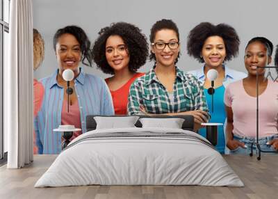 civil rights, ethnicity and people concept - group of happy african american women over grey background Wall mural