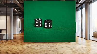 close up of black dice on green casino table Wall mural