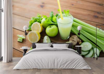 close up of glass with green juice and vegetables Wall mural