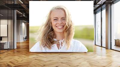 close up of happy young woman in white outdoors Wall mural