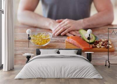 close up of male hands with food rich in protein Wall mural