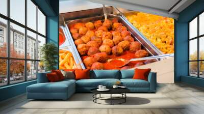 close up of meatballs and other dishes on tray Wall mural