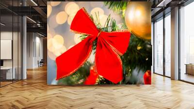 close up of red bow decoration on christmas tree Wall mural