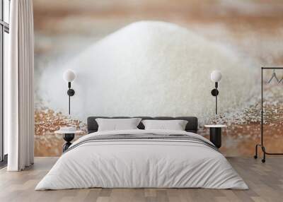 close up of white sugar heap on wooden table Wall mural