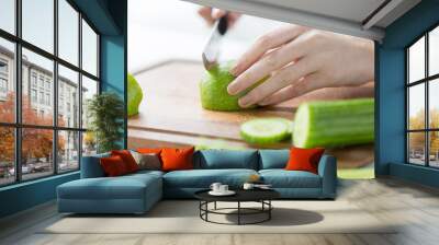 close up of woman hands chopping green vegetables Wall mural