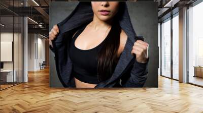 close up of woman posing and showing sportswear Wall mural