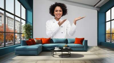 cooking, advertisement and people concept - happy smiling female chef in white jacket holding someth Wall mural