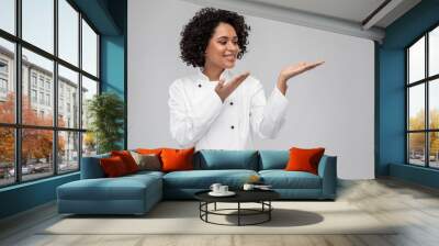 cooking, advertisement and people concept - happy smiling female chef in white jacket holding someth Wall mural