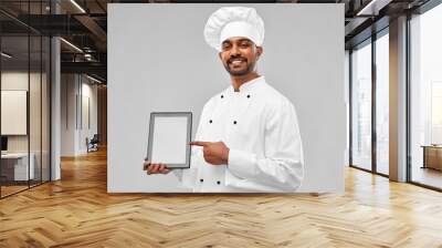 cooking, technology and people concept - happy male indian chef in toque with tablet computer over grey background Wall mural