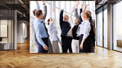 corporate and teamwork concept - happy business team making high five or celebrating success at office Wall mural