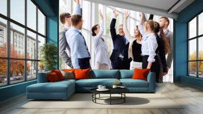 corporate and teamwork concept - happy business team making high five or celebrating success at office Wall mural