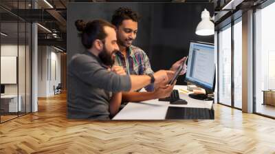 deadline, technology and people concept - creative team with tablet pc computer working together late at night office Wall mural