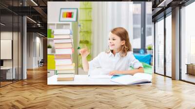 education and school concept - happy smiling student girl reading book over home background Wall mural