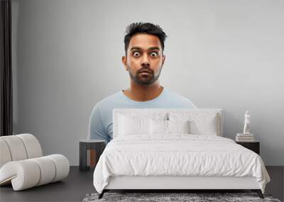 emotion, expression and people concept - shocked or scared man in t-shirt over grey background Wall mural