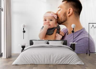 family, fatherhood and people concept - close up of happy father kissing little baby daughter Wall mural