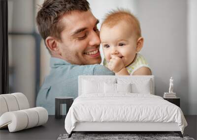 family, fatherhood and people concept - happy father holding little baby daughter at home Wall mural