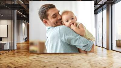 family, fatherhood and people concept - happy father holding little baby daughter at home Wall mural