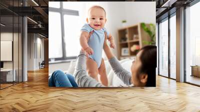 family and motherhood concept - happy young asian mother with little baby son at home Wall mural