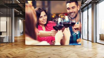 friends clinking glasses of wine at restaurant Wall mural