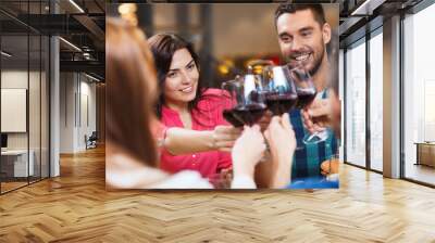 friends clinking glasses of wine at restaurant Wall mural