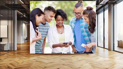 friendship, technology and international concept - group of happy smiling with smartphone outdoors Wall mural