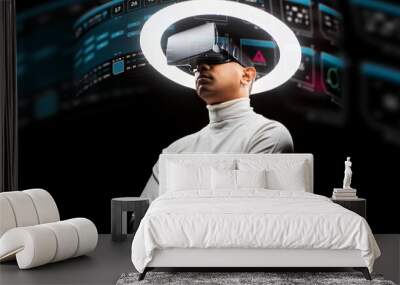 future technology, augmented reality and cyberspace concept - man in vr glasses under white illumination with virtual screens projection over black background Wall mural