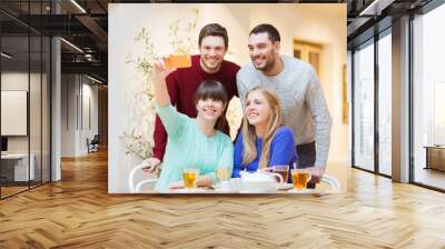 group of friends taking selfie with smartphone Wall mural