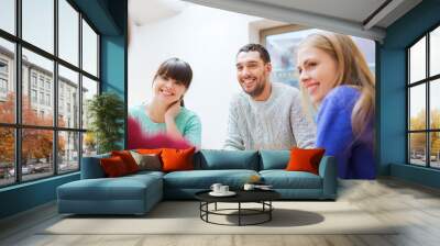 group of happy friends meeting and talking Wall mural