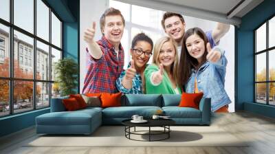 group of happy students showing thumbs up Wall mural