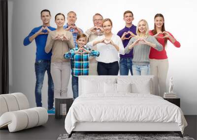 group of smiling people showing heart hand sign Wall mural