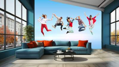 group of teenagers jumping Wall mural