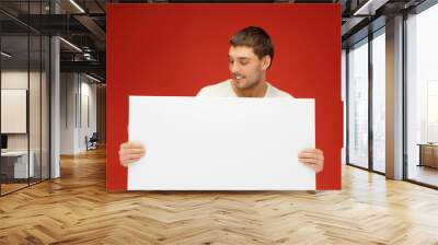 handsome man with big blank board Wall mural