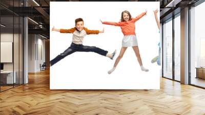 happiness, childhood, freedom, movement and people concept - happy kids jumping in air over white ba Wall mural