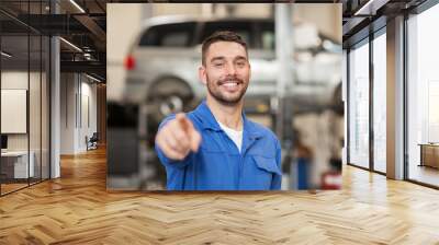 happy auto mechanic man or smith at car workshop Wall mural