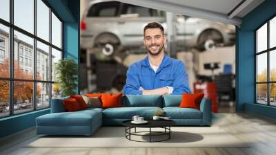 happy auto mechanic man or smith at car workshop Wall mural