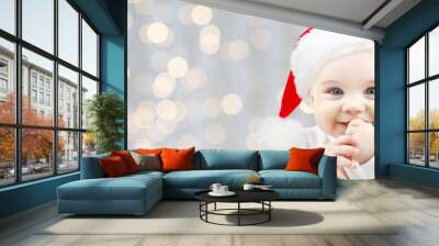 happy baby in santa hat over holidays lights Wall mural