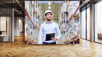 happy businessman with clipboard at warehouse Wall mural