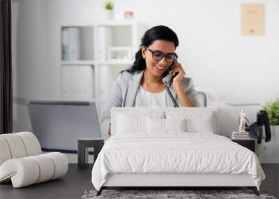 happy businesswoman calling on phone at office Wall mural