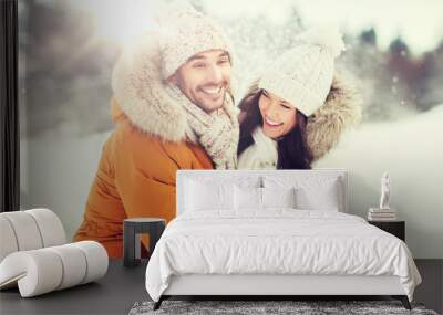 happy couple hugging and laughing in winter Wall mural