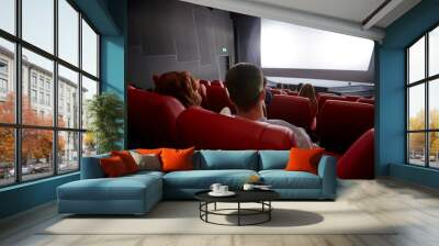 happy couple watching movie in theater or cinema Wall mural