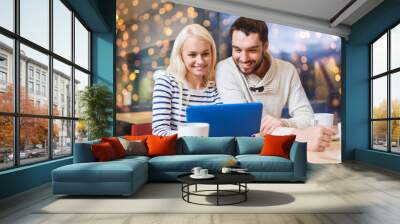 happy couple with tablet pc and coffee at cafe Wall mural