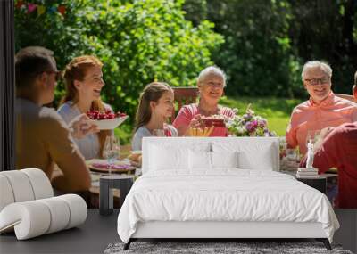 happy family having dinner or summer garden party Wall mural