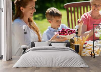 happy family having dinner or summer garden party Wall mural