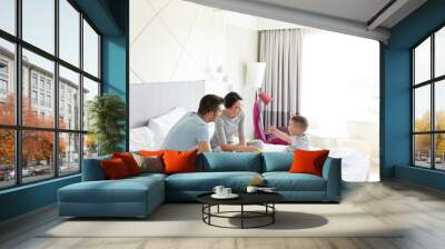 happy family in bed at home or hotel room Wall mural