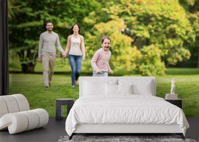 happy family walking in summer park and having fun Wall mural