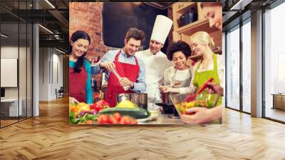 happy friends and chef cook cooking in kitchen Wall mural