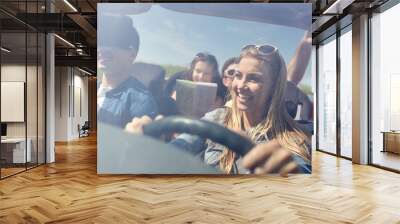 happy friends driving in cabriolet car Wall mural