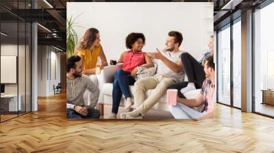 happy friends with popcorn and beer at home Wall mural