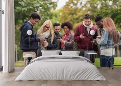 happy friends with smartphone and coffee outdoors Wall mural